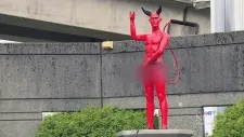 Erect Satan statue